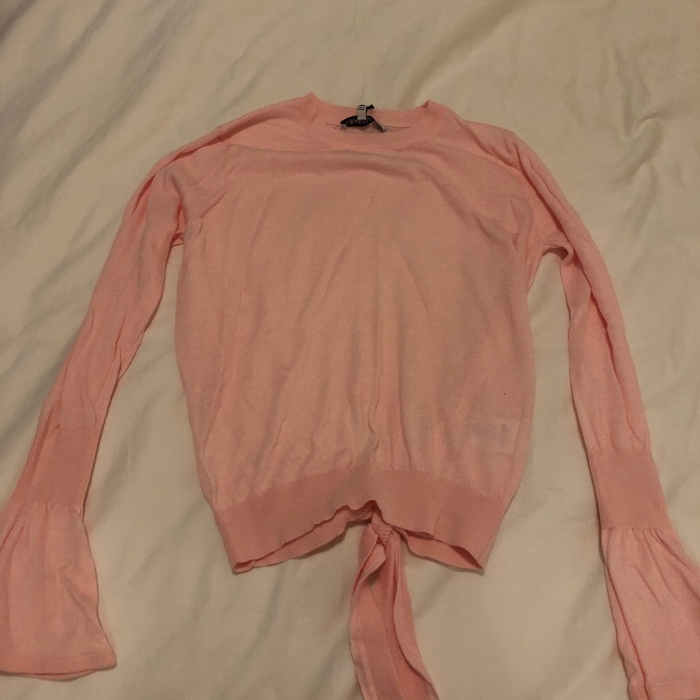 Long-sleeve pink blouse with bell sleeves